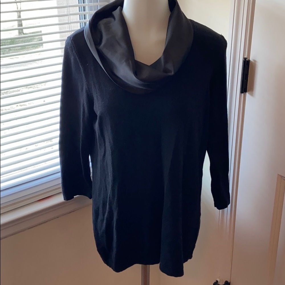Woman’s sweater with silk neck.